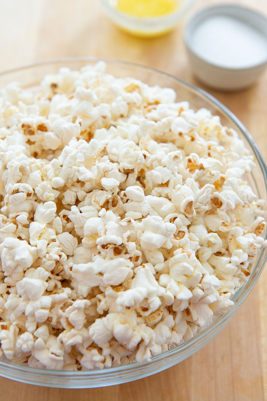 Ingredients to make popcorn, including butter, corn grains